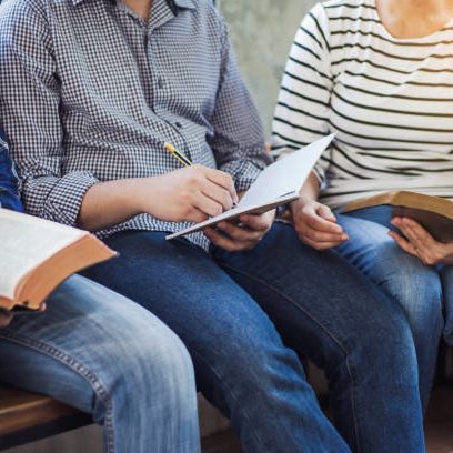 close up of christian group are reading and study bible together in Sunday school class room